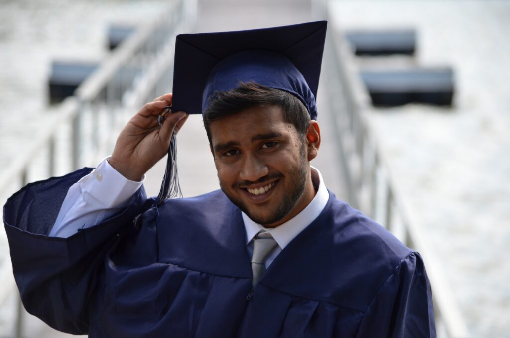 student on graduation day cap and gown