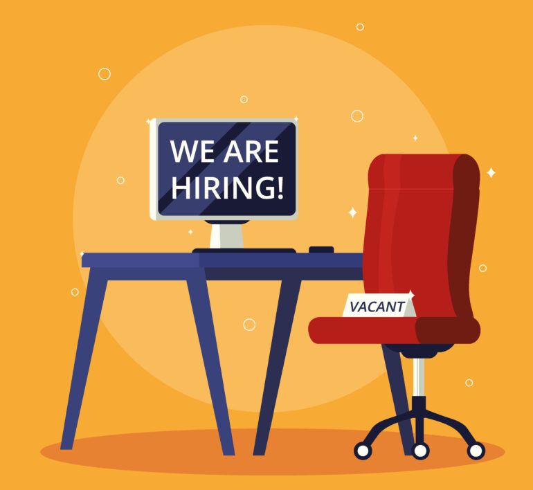"We are hiring, vacant job" With a desk, table and office chair.