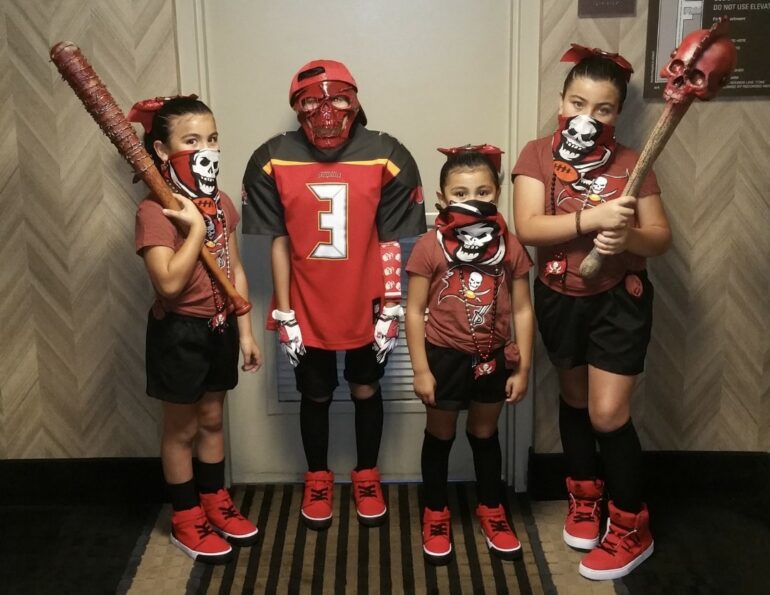 Ariana 14, Ayden 12, Alyssa 10, and Aliyah 8 all dressed up for a watching a game.